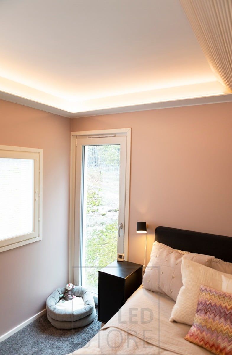 Bedroom ceiling with LED strip mounted on a drop-down light, facing the ceiling and forward. Ledstore.fi