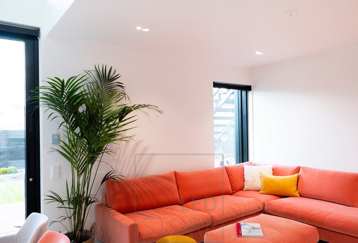 Spotlights in the living room ceiling illuminating a group of sofas. Ledstore.fi