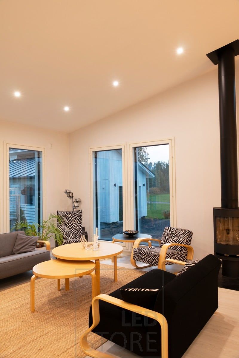 Spotlights on a sloping ceiling as yeast lighting - positioned around the space. Ledstore.fi