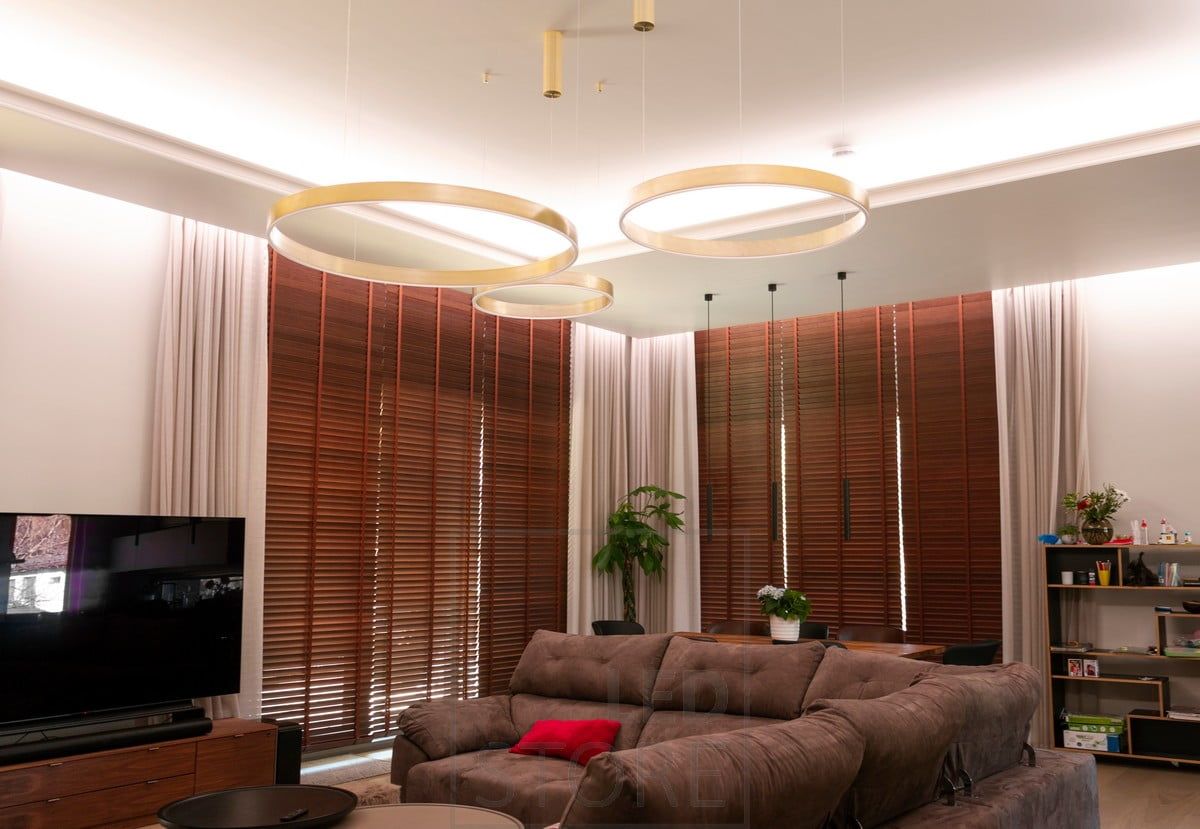 In the living room, LED strip on both the lowering lip and between the lowering and the wall. The groove was left wide enough to hide the curtain tracks. Ledstore.fi