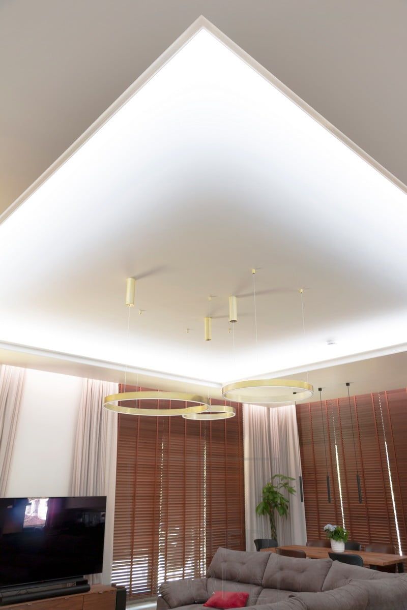 Led ribbon in a downlight clip around the living room, directed towards the ceiling, creating a beautiful light canopy. Ledstore.fi
