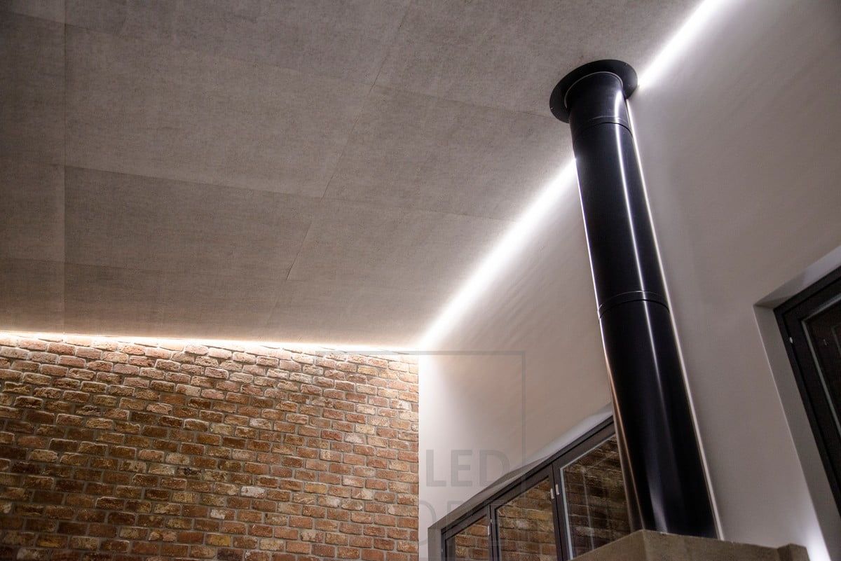Soft, indirect mood lighting on the living room ceiling. A LED strip of light circulates around the space in a groove between the ceiling and the wall. Ledstore.fi