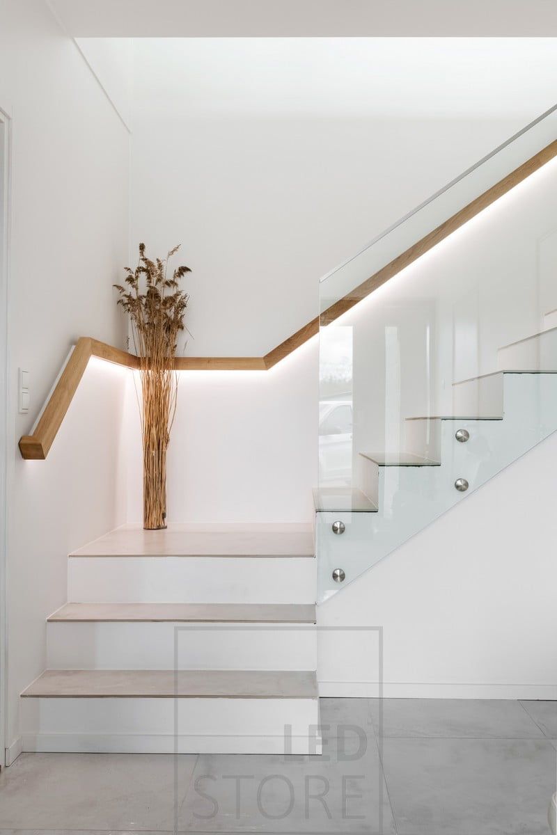Stair railing with led strip illuminating downwards. Uppo profile milled into the handrail. Ledstore.fi