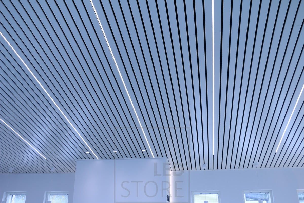 In a strip ceiling, LED strip lights in a low profile surface between the strips. The lighting is pleasantly even and accentuates the roof's cornices. Ledstore.fi