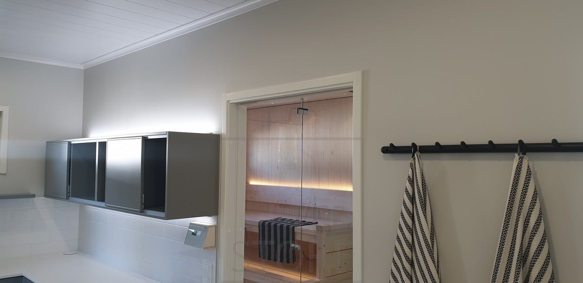 In the back of the sauna, an LED strip on the backrest provides atmospheric light upwards and downwards on the floor below. Soft, indirect light. Ledstore.fi