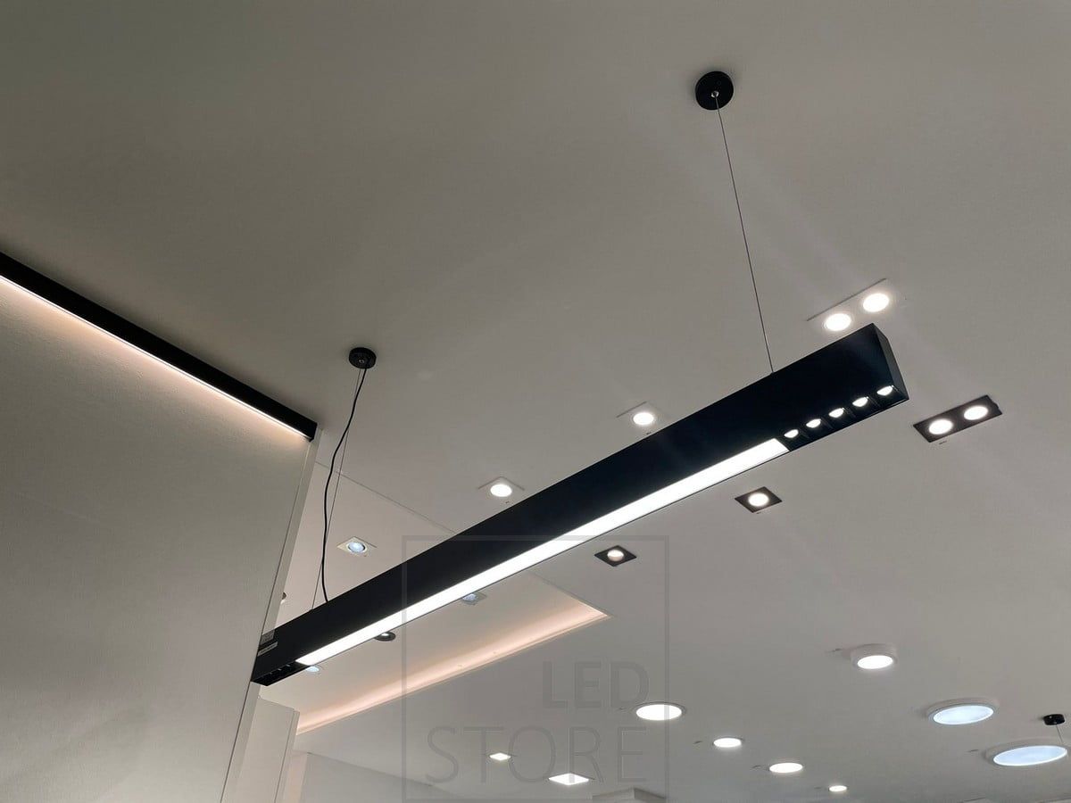 Ledstorella Viiva luminaire above the sales counter. Led strip on a replacement aluminium profile in the ceiling to provide indirect light and spotlights and panel lights on the ceiling. Ledstore.fi
