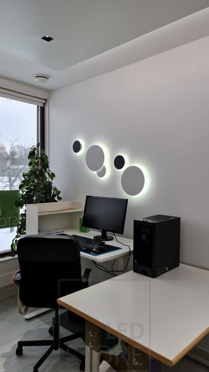 In the study, Eclipse wall lights in two different sizes, in two different colours, illuminating indirect light through the wall. The luminaires can be put together to create exactly the set you want, and the light is colour temperature adjustable. Ledstore.fi