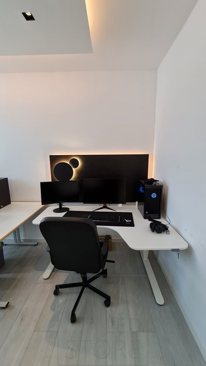 Indirect light on the ceiling and behind the computer in the workspace. The workstation is lit with atmospheric indirect light from an LED strip and Eclipse wall lights. Ledstore.fi