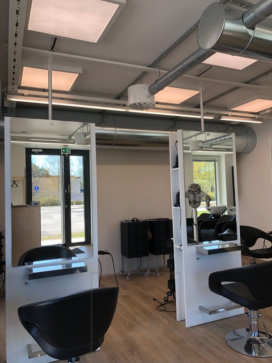 A 600x600 panel on the ceiling of the hairdressing salon to illuminate and create uniform, efficient and adaptable lighting. The luminaire can either be recessed into the ceiling or surface mounted. The light has an opening angle of 110 degrees, so the light does not leave shadows in the space, but illuminates the entire space evenly. The light is dimmable and colour temperature adjustable. Ledstore.fi