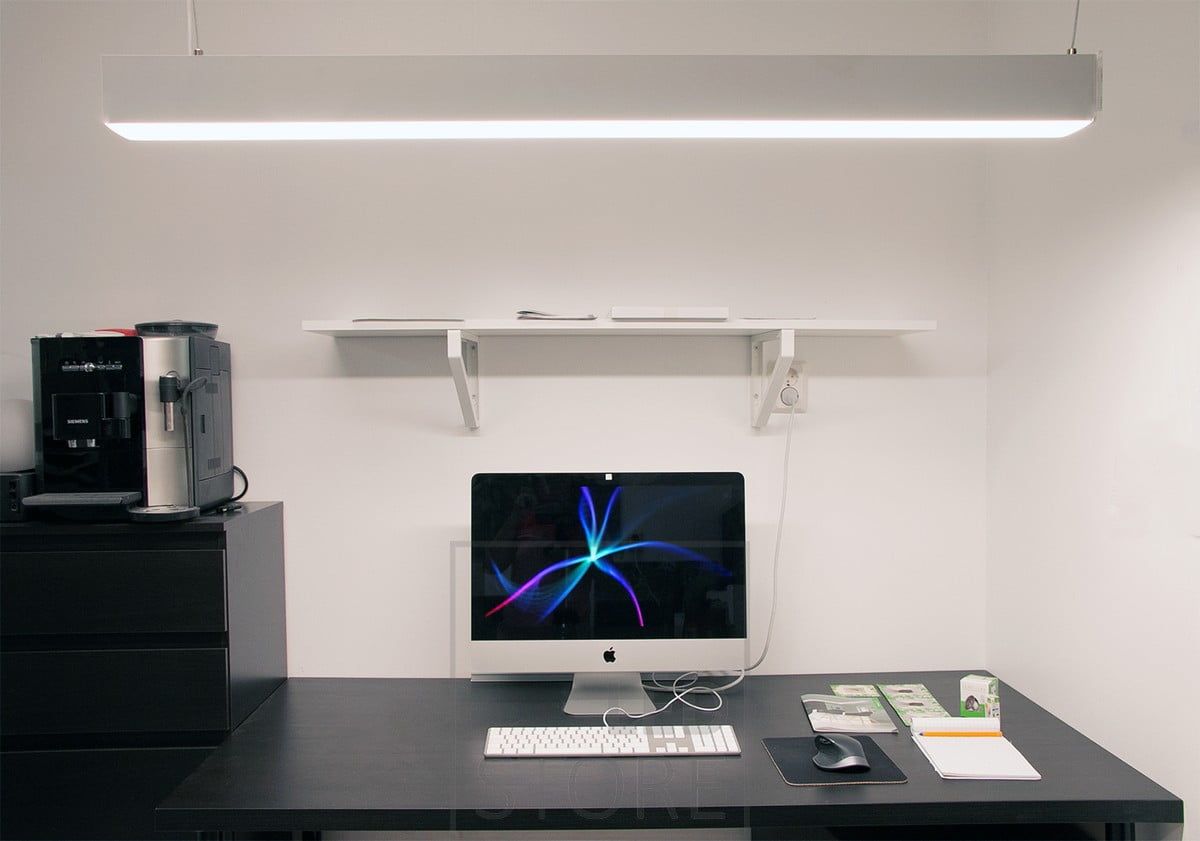 A custom-made luminaire to illuminate a work space. Inside the profile are colour temperature controlled LED strips so the light is efficient and can be adjusted as required. Ledstore.fi