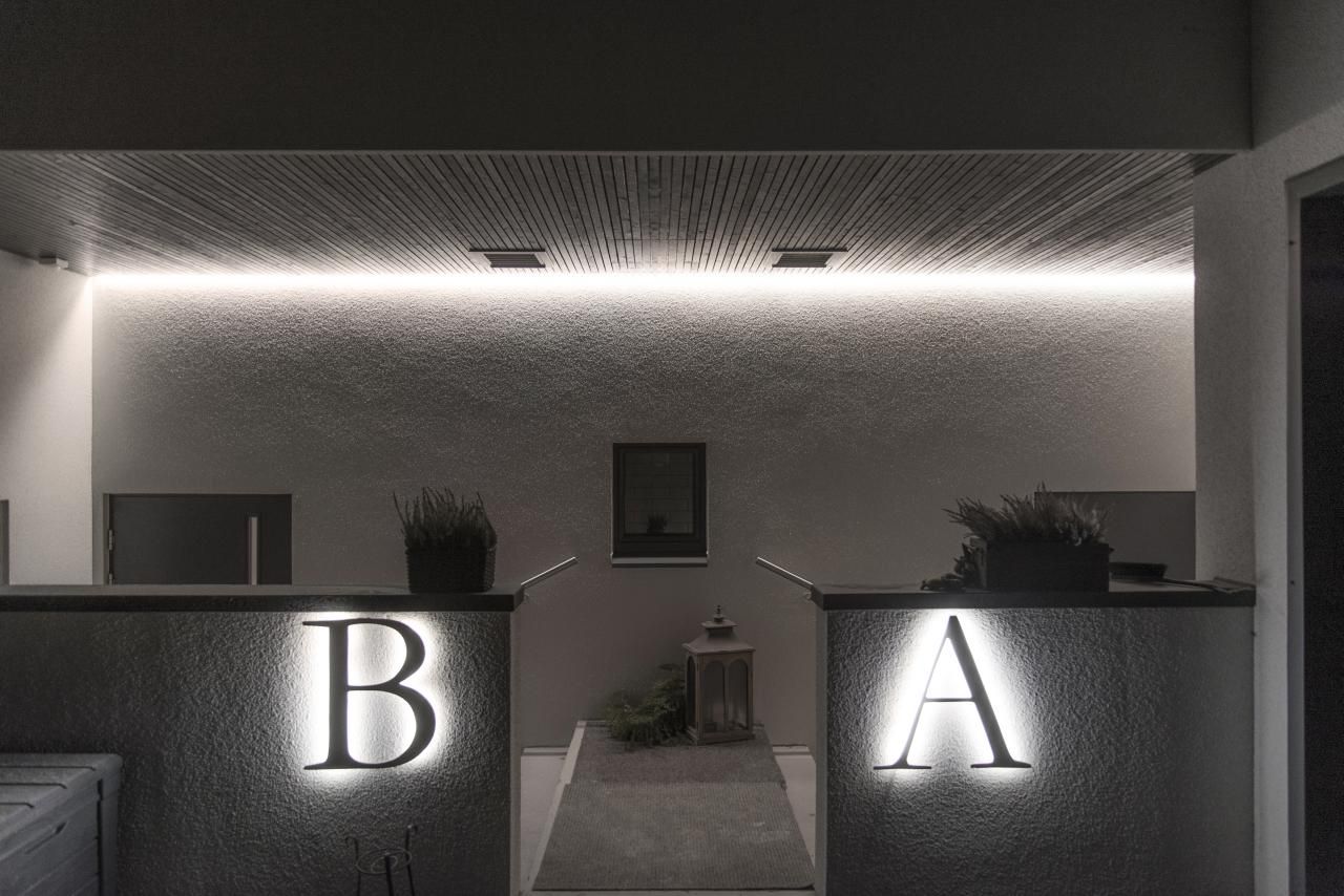 On a green background is a white square frame with "LED STORE" in bold white letters, "LED" aligned above "STORE". Perfect for energy efficient lighting.