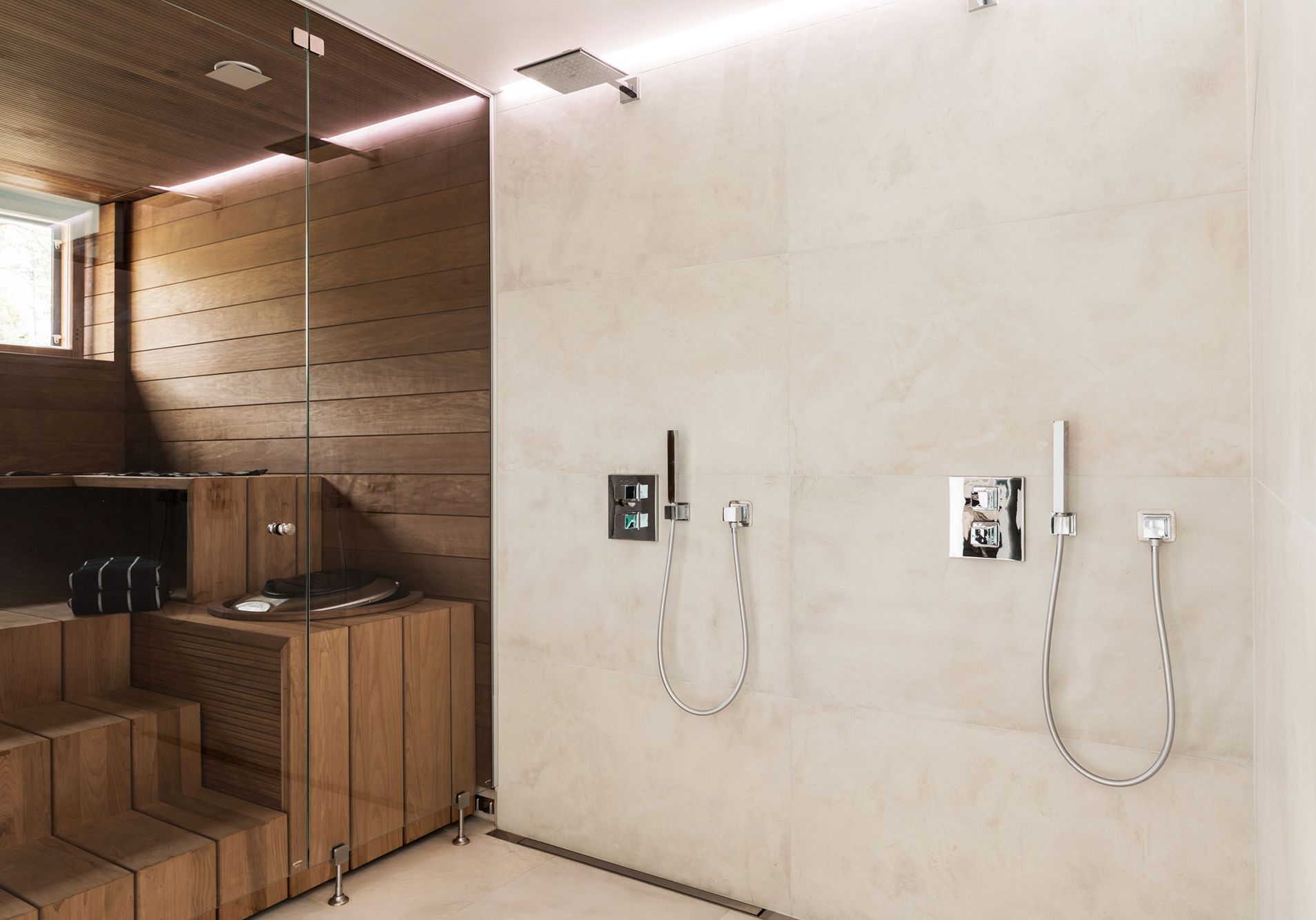 Indirect light behind the shower in the bathroom. Led strip in waterproof profile between ceiling and wall in a groove. Ledstore.fi