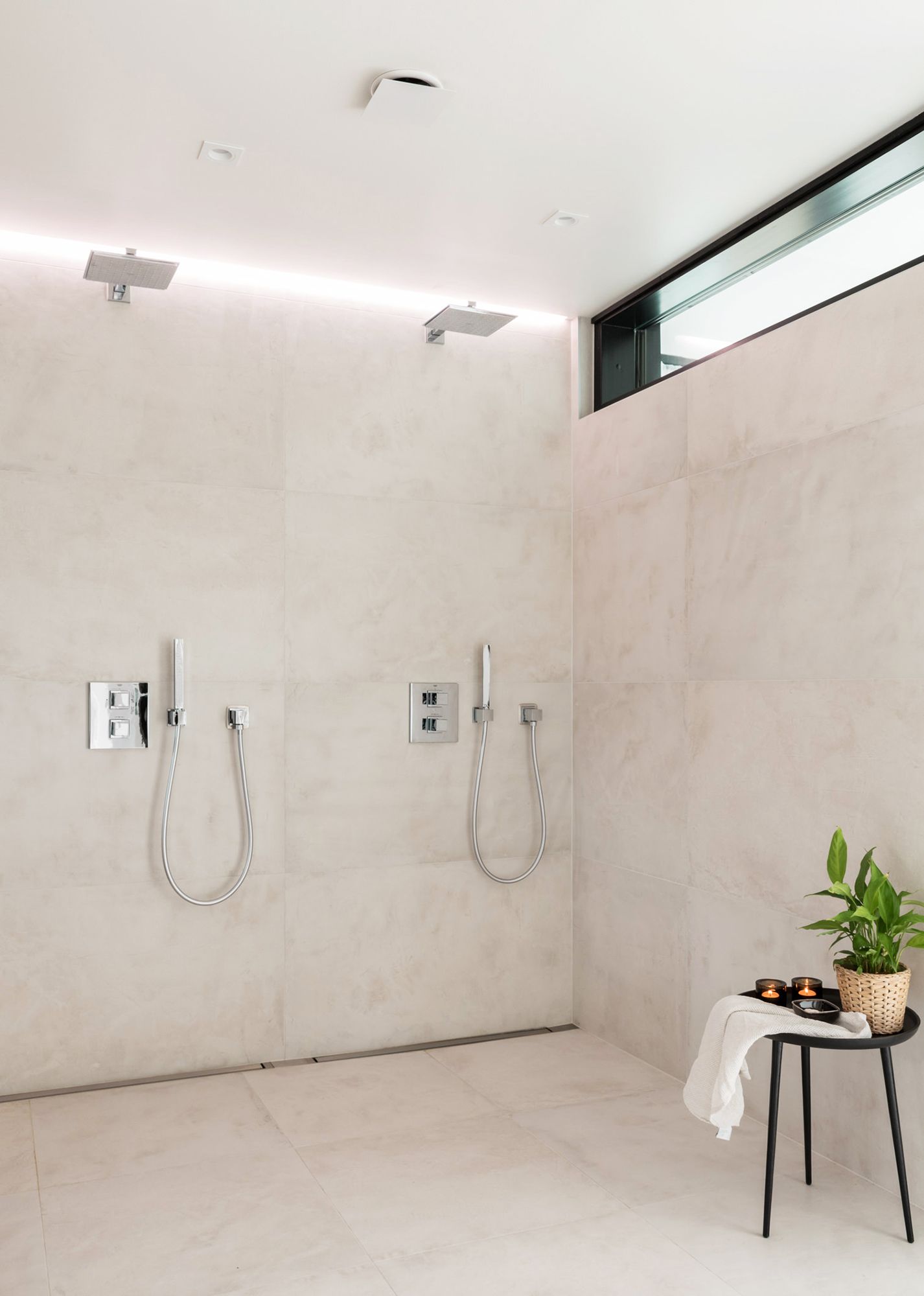 Indirect light behind the shower. Led strip in a groove between ceiling and wall. Ledstore.fi