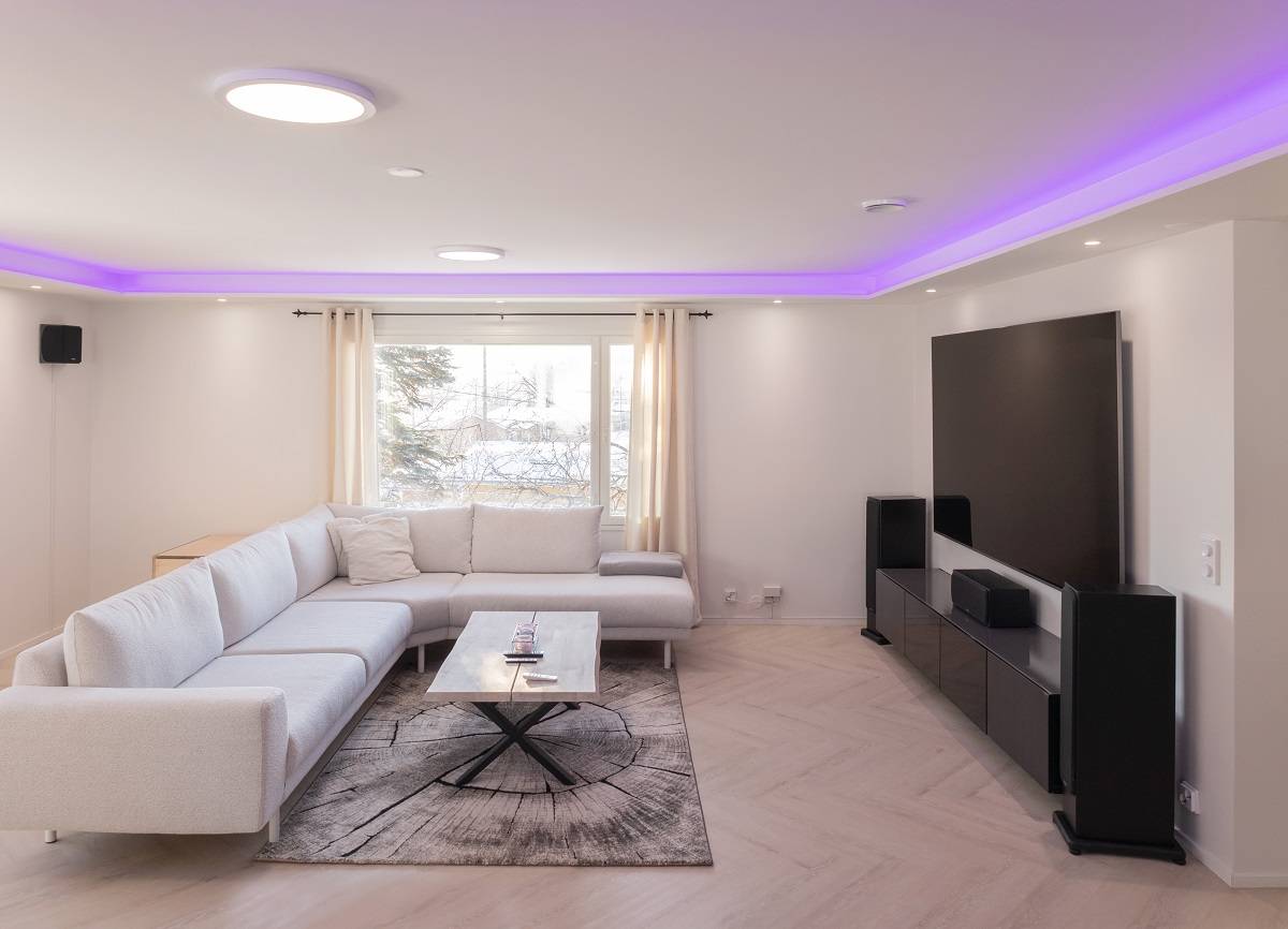 Living room RGB+CCT led strip lit in low light.