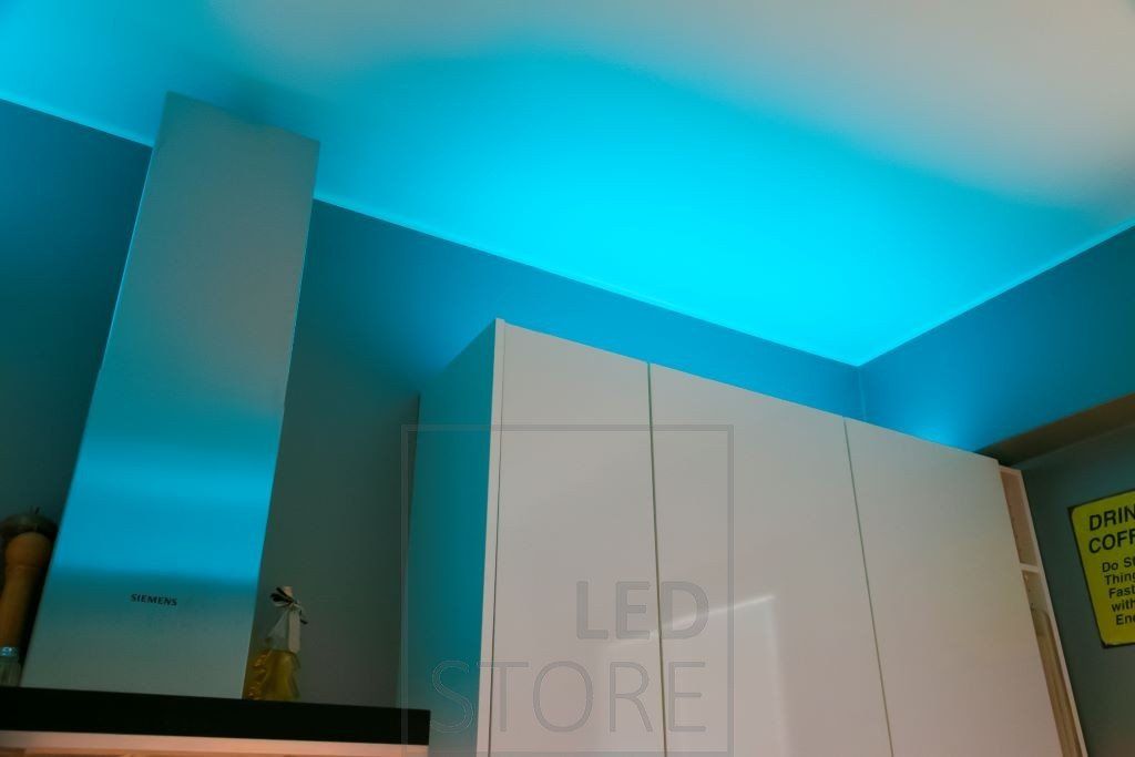 RGB+W LED strip mood lighting for the kitchen, LED strip in low profile on top of the cabinets. Ledstore.fi