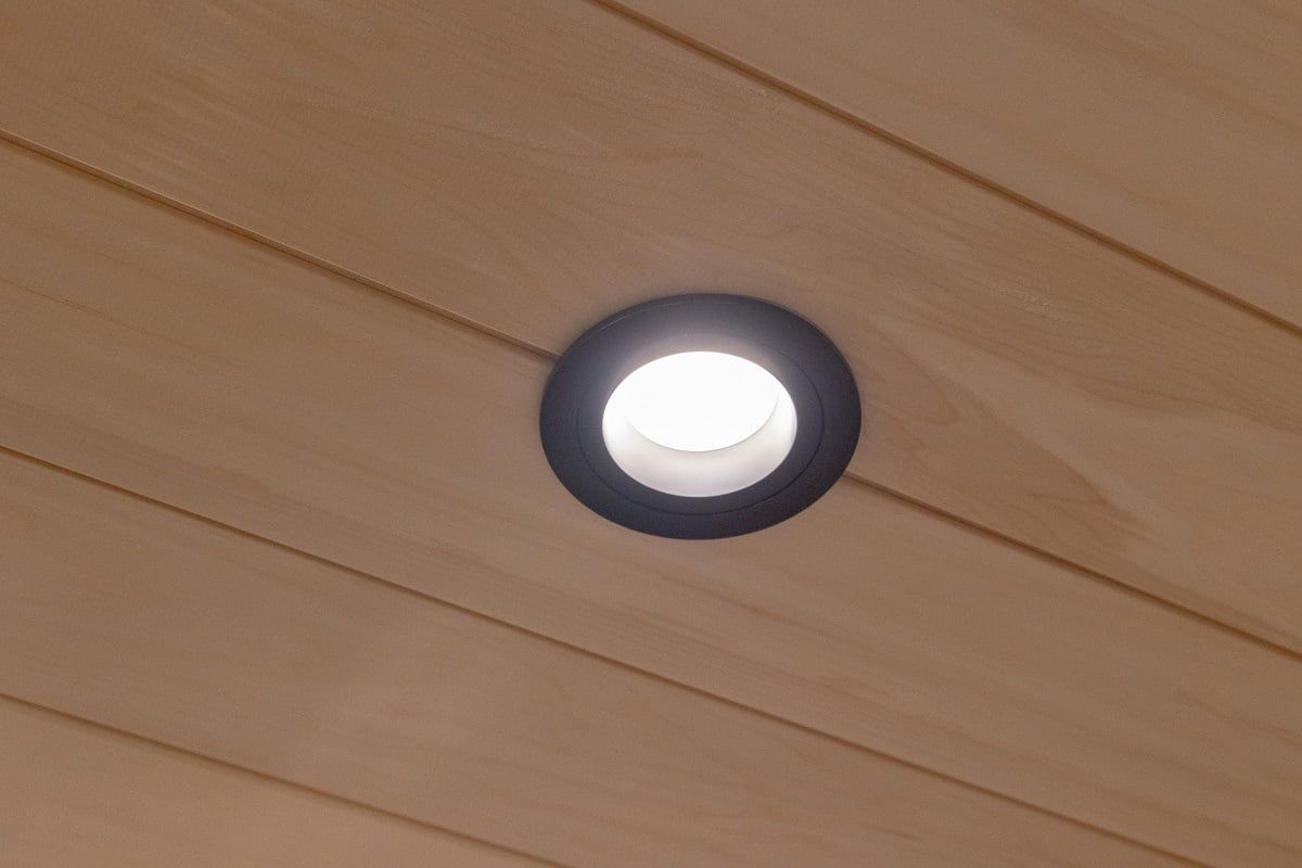 For the lounge, the R023B round black 9W spotlight, which is waterproof, has been chosen to match the panelled ceiling. ©LedStore