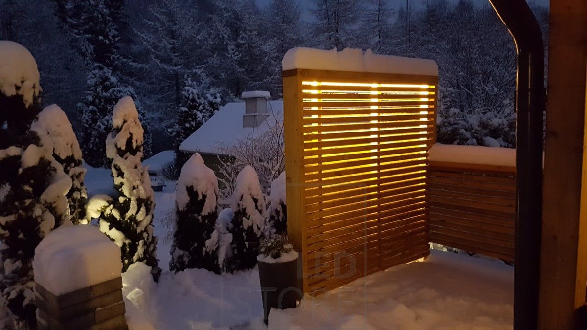 Indirect mood lighting in the yard, led strip inside the fence. Ledstore.fi