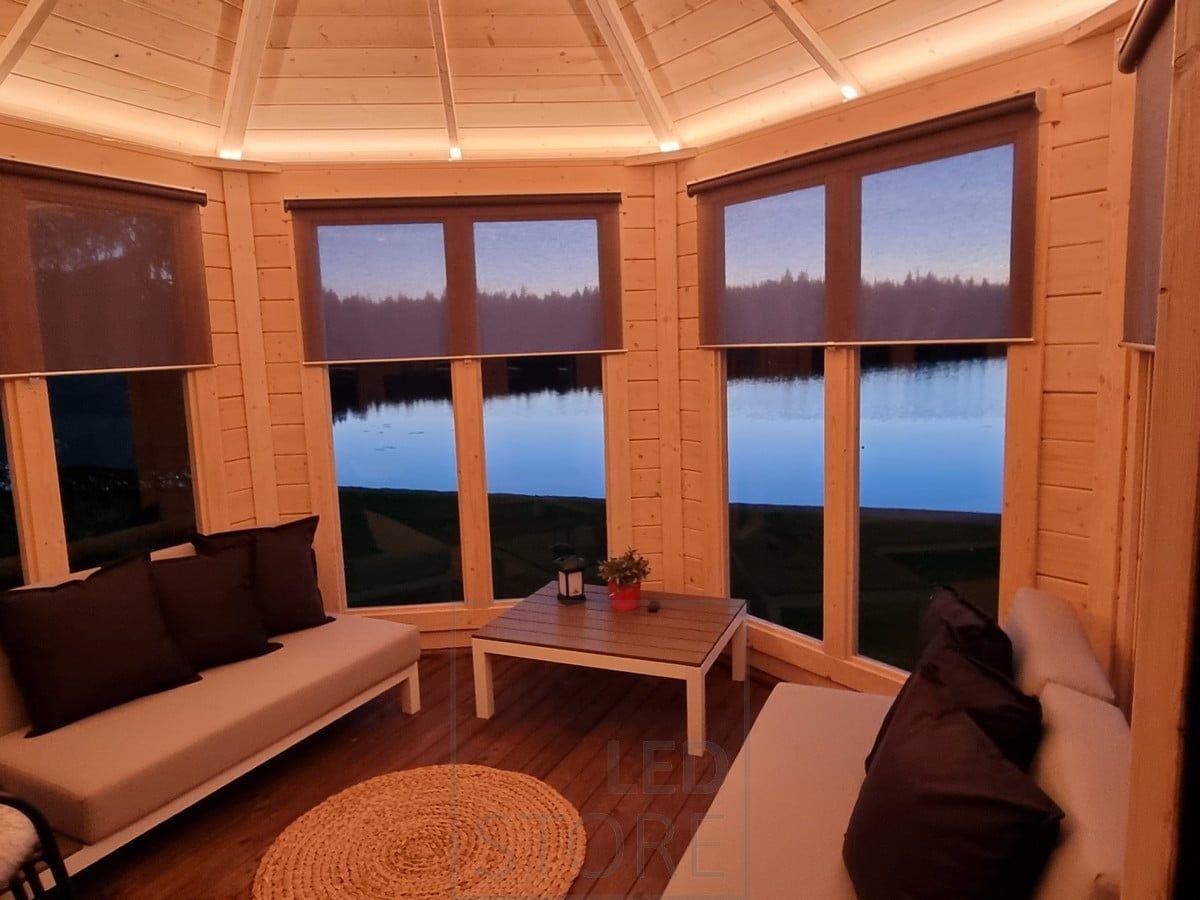 A beautiful ceiling accentuated with lighting, creating mood lighting in the space. Ledstore.fi