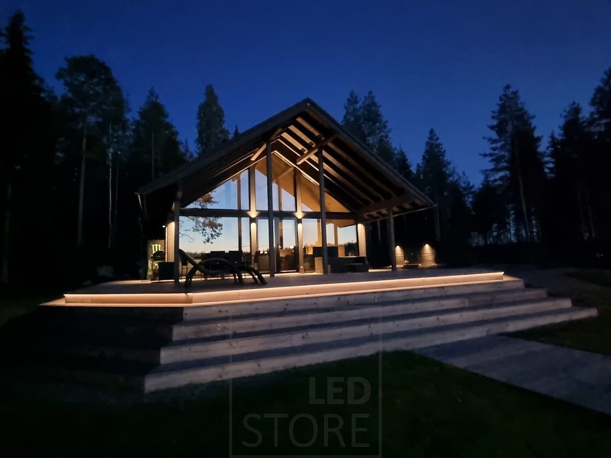 Versatile outdoor lighting realized with LED strip on the staircase and wall lights. Ledstore.fi