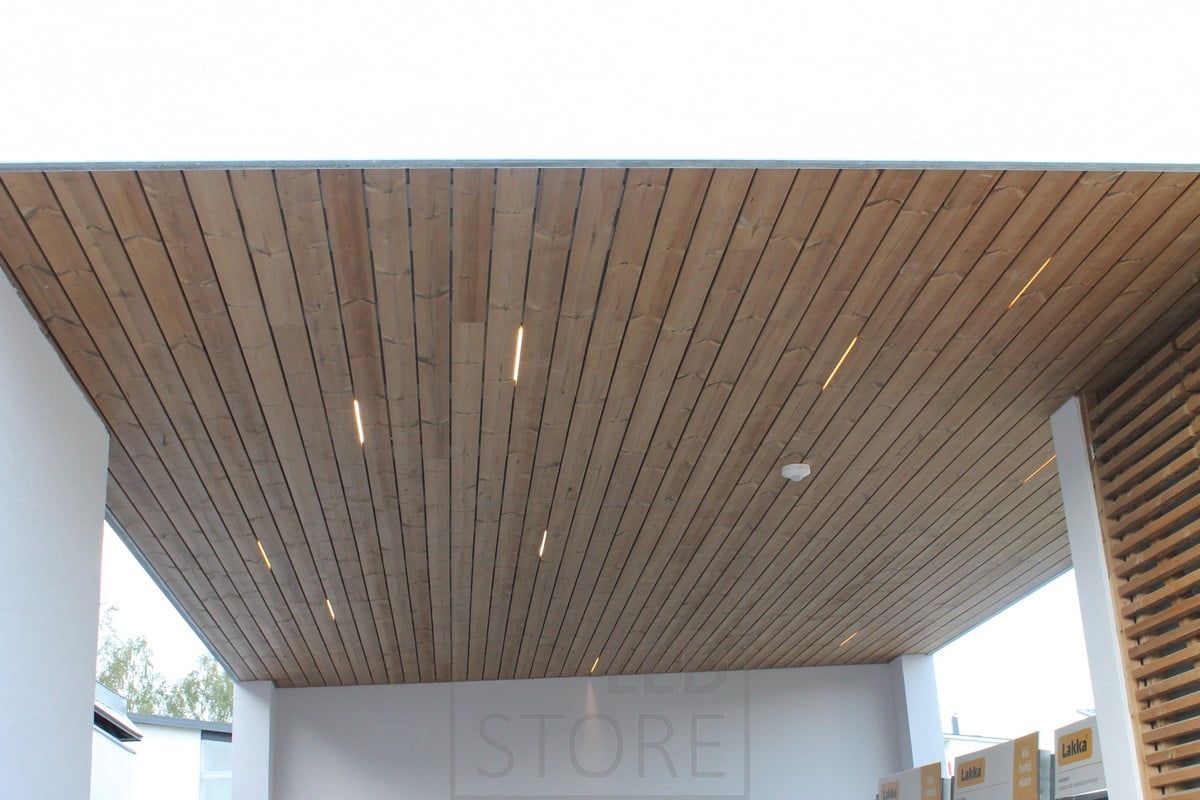 Snippets of LED strip between the ceiling panelling create atmospheric and expressive lighting. Ledstore.fi