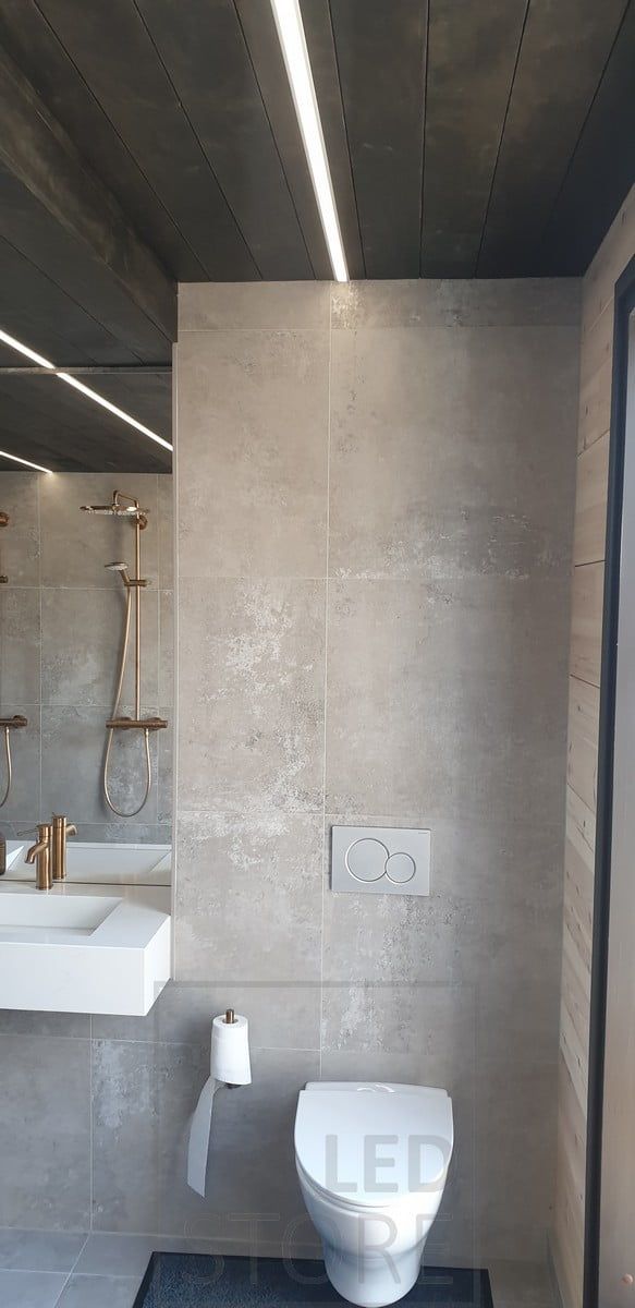 Led strip on the ceiling of a toilet room as general lighting. Ledstore.fi