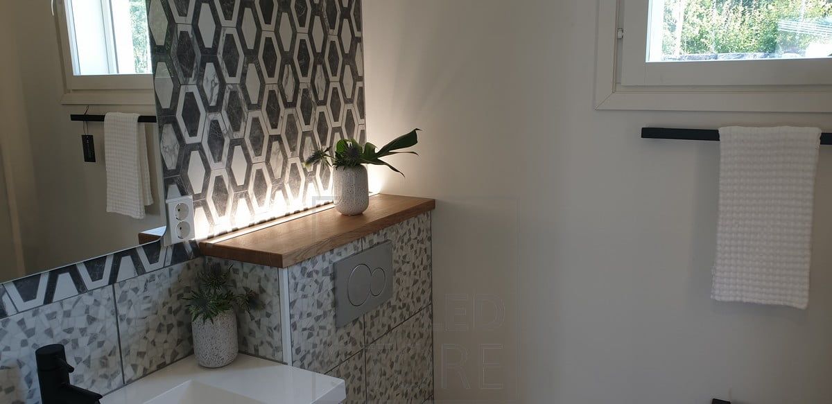 LED strip behind the toilet housing, facing upwards, creating a beautiful mood light, also works as a night light. Ledstore.fi
