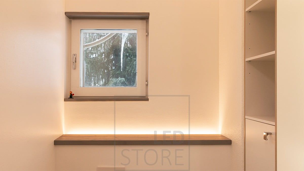A wall-mounted toilet enclosure with an LED strip facing upwards. Creating an atmospheric light in the space, it is switched on by a motion sensor so it also works well as a night light. Ledstore.fi