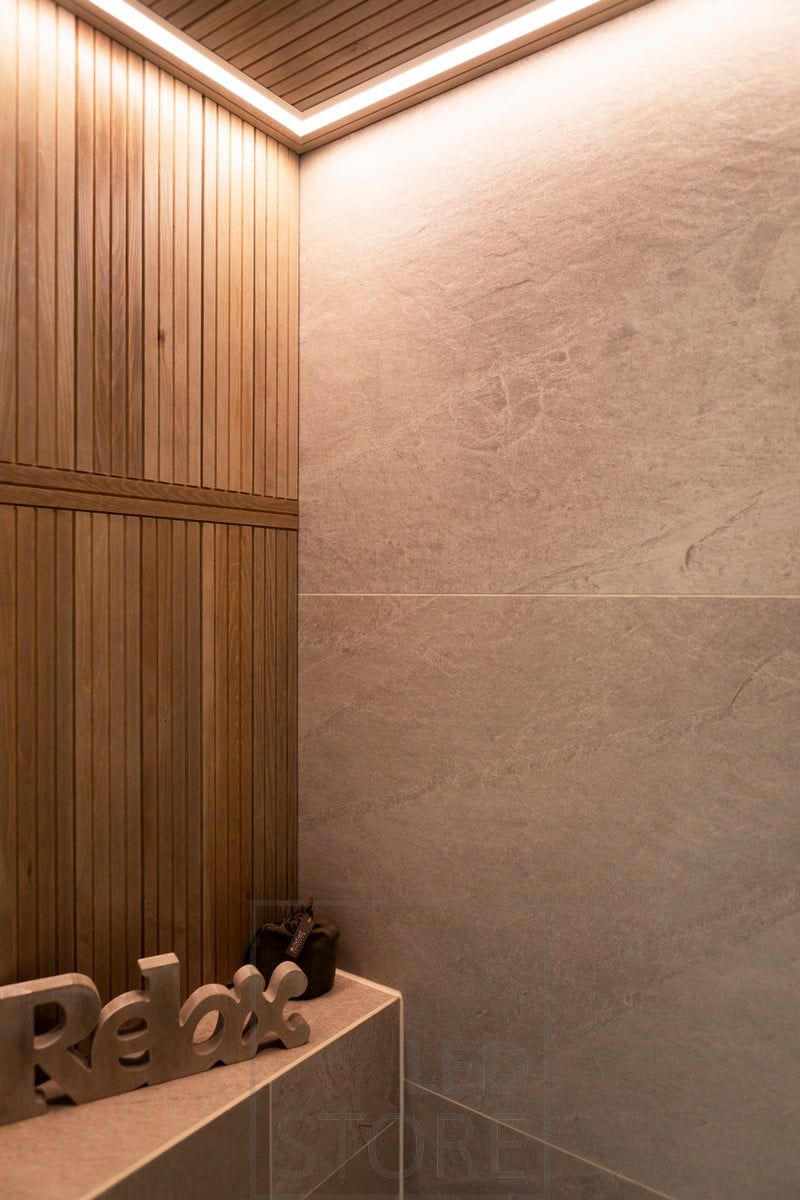 Led ribbon in a narrow flush-mounted profile, circling the space, in a beautifully finished cornice. Ledstore.fi