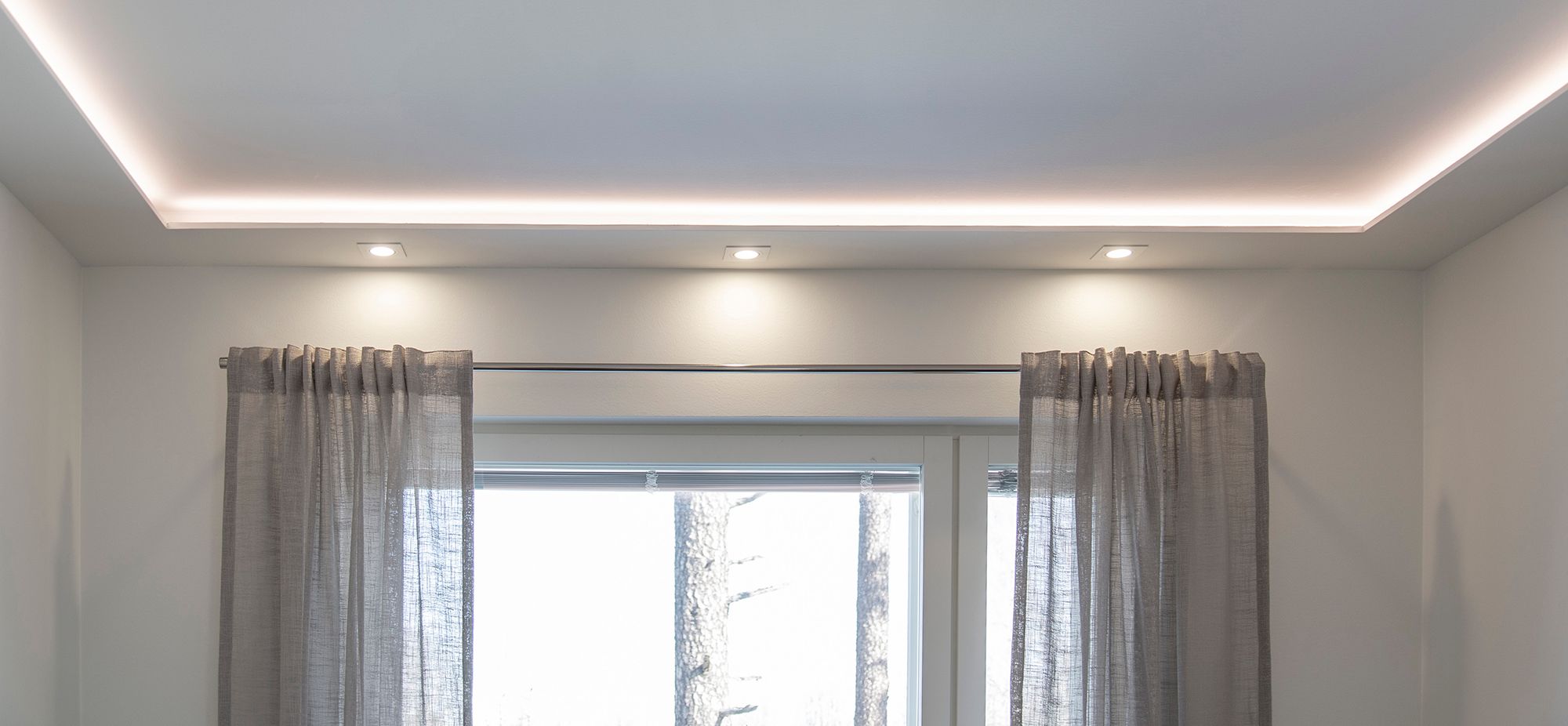 Soft and atmospheric lighting with LED strip and spotlights in a downlight clip. Ledstore.fi