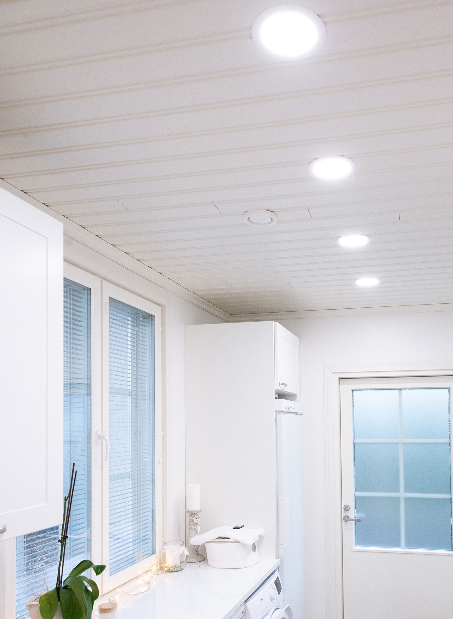 A utility room lit with ceiling luminaires for uniform and efficient lighting. Ledstore.fi