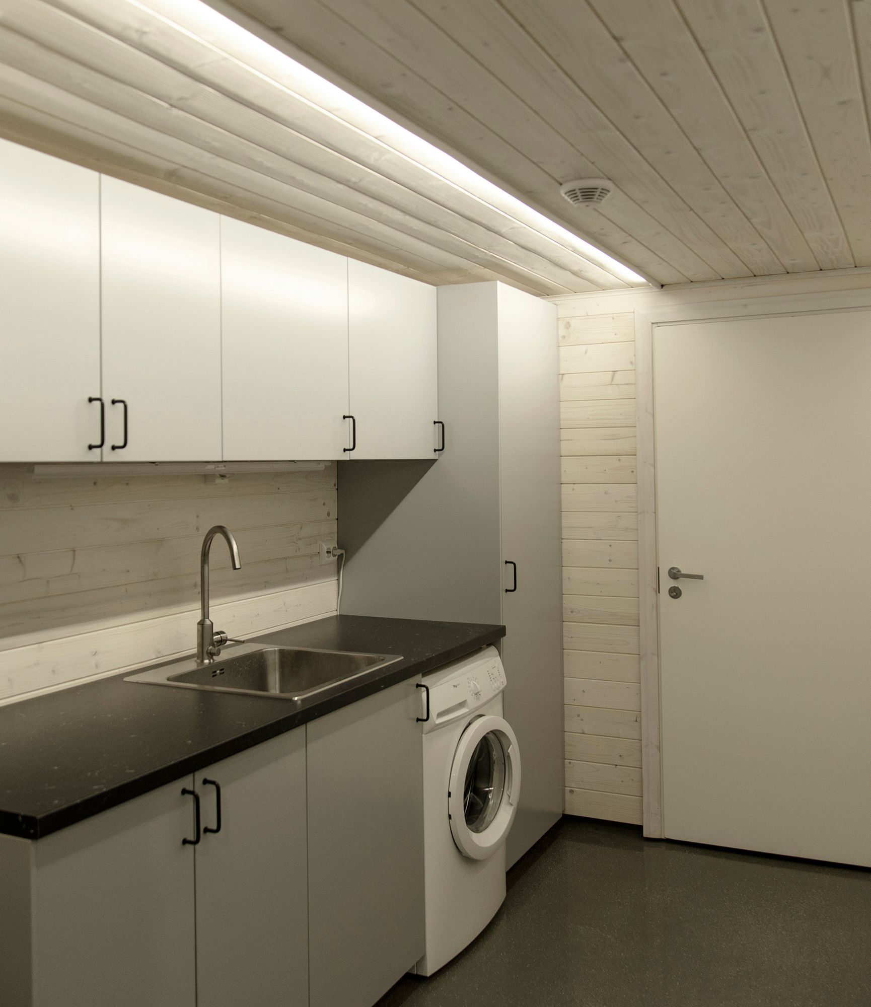 Led strip surface mounted to provide general lighting in a space. The profile is oriented towards fixed furniture to provide light where it is most needed. Ledstore.fi
