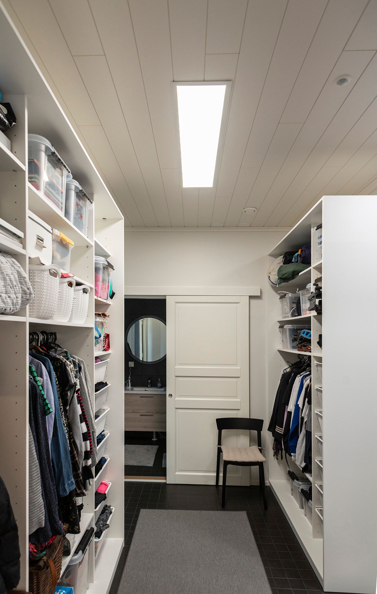 UPPOAVA Led Panel 300x1200 light fixture illuminating the wardrobe efficiently and evenly. Ledstore.fi
