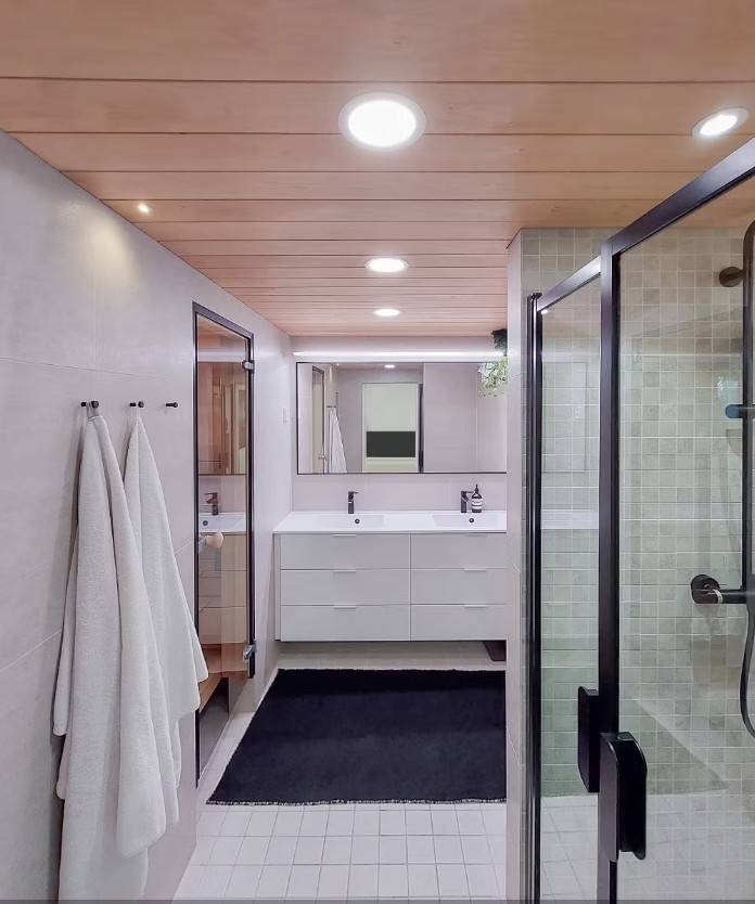 Bathroom lighting with panel lights, spot lights, LED track lights in front of the mirror and waterproof spots on top of the sink.