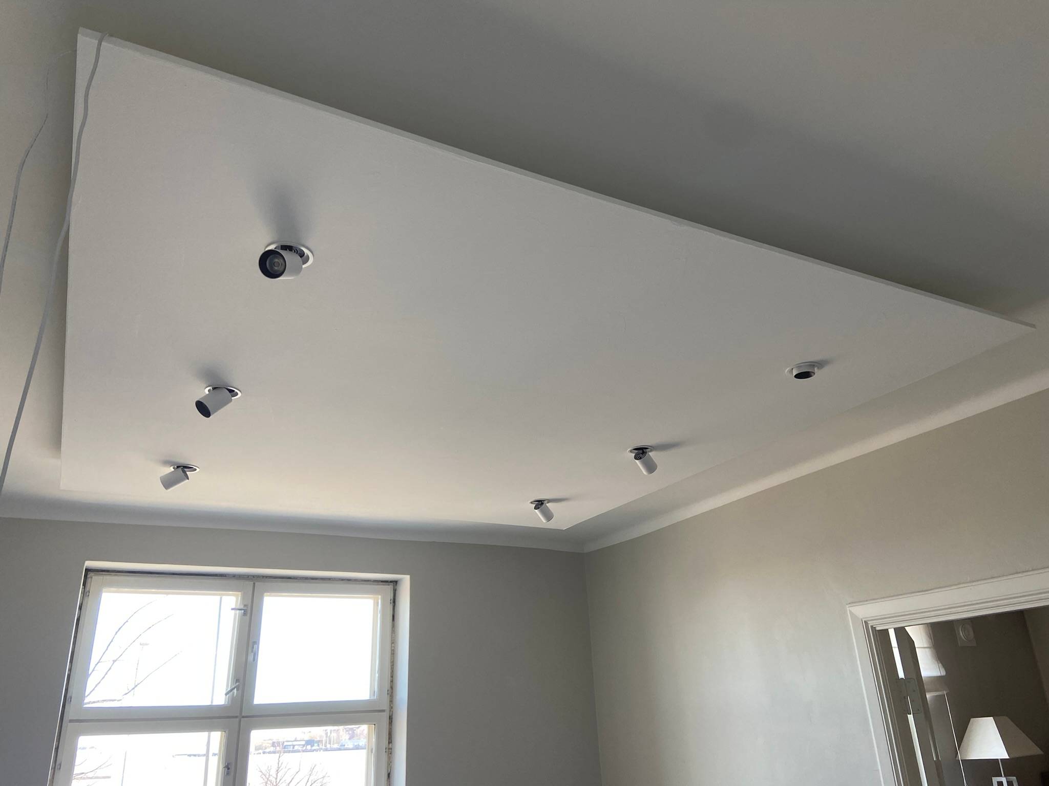 Installation underway for six Kolo spots. A drop of plasterboard has been made in the ceiling to create more installation space. 