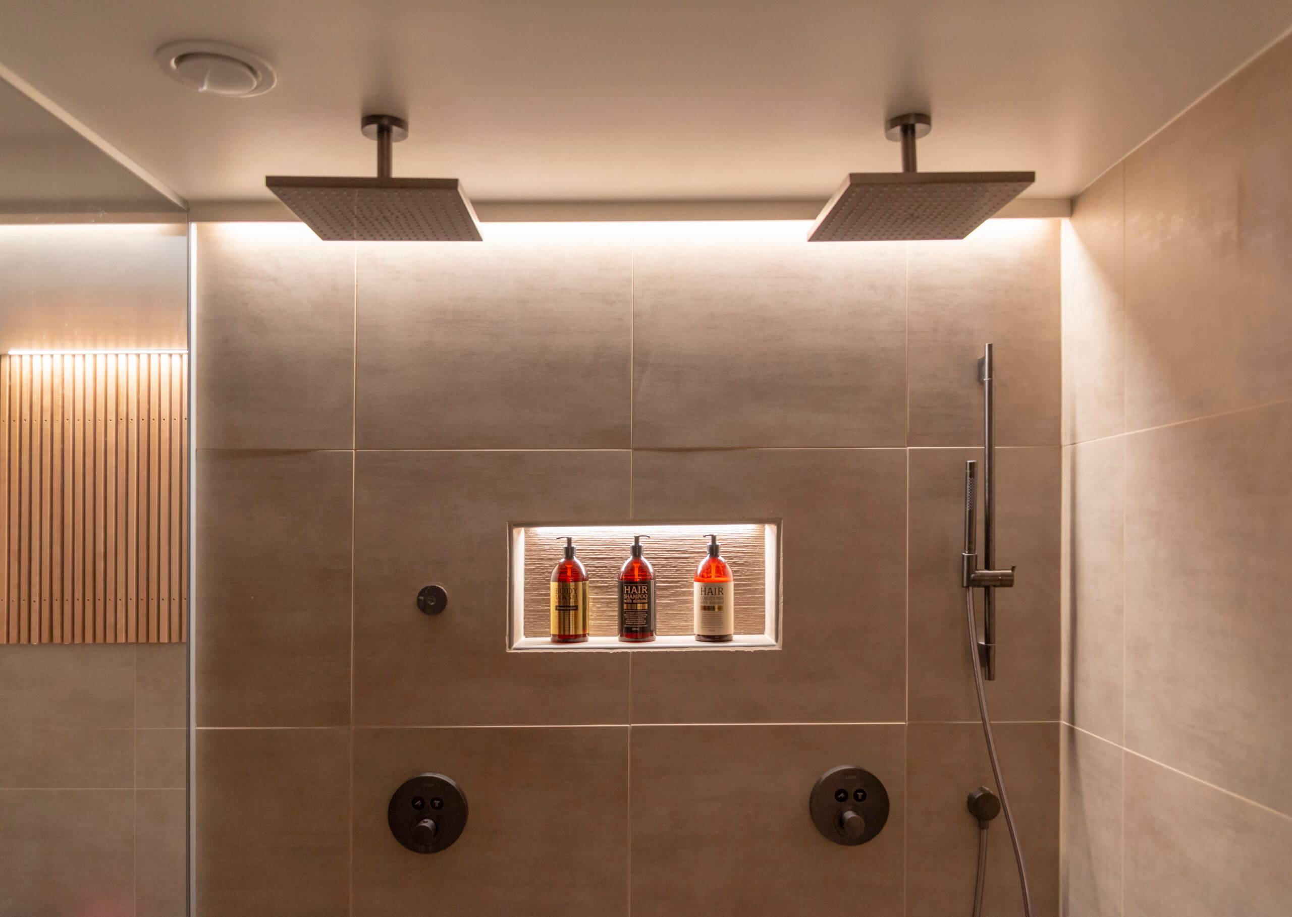 leds in bathroom behind shower on the ceiling