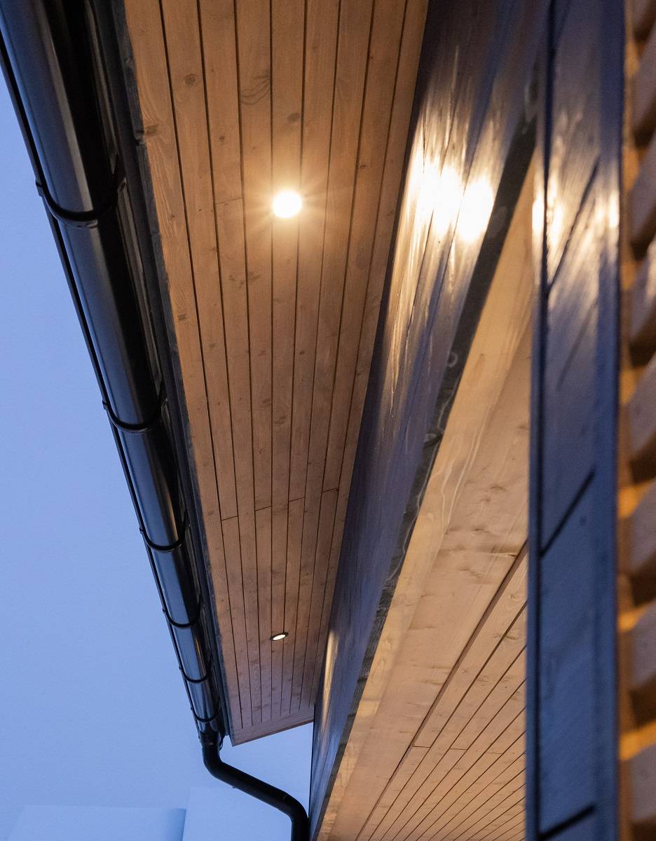 LED exterior lighting in the eaves, LED spotlights installed to softly illuminate the exterior wall.