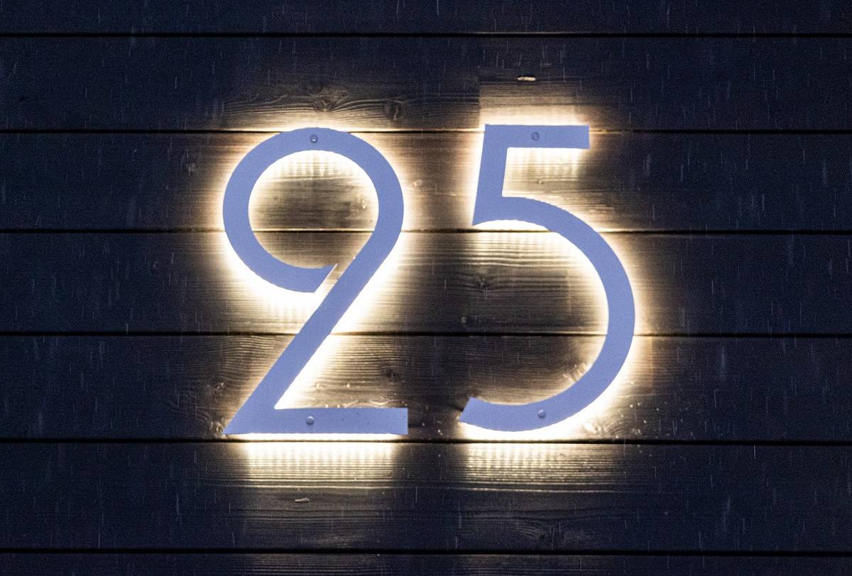 LED number lighting can be implemented using modern small LED units. Here, the lights are evenly spaced in the background of the number.