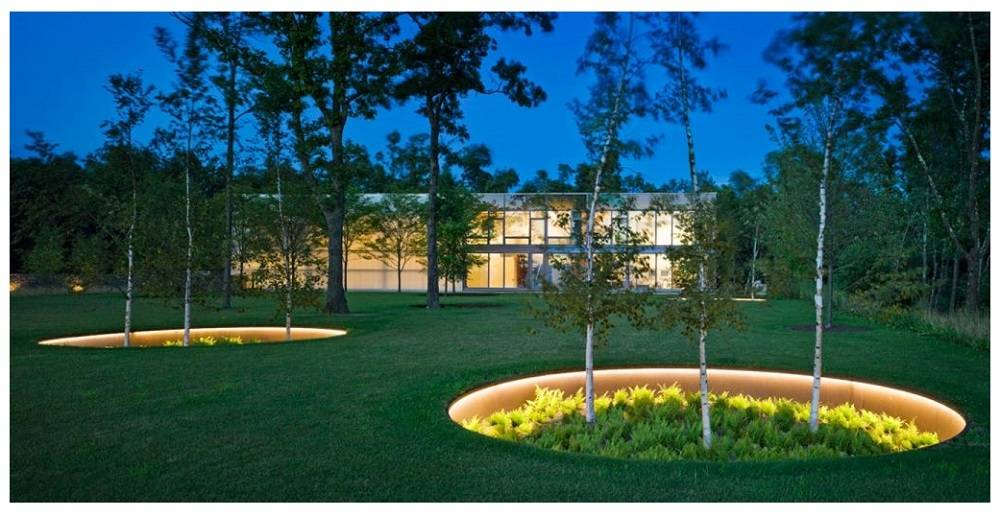 A recessed flower bed with LED strip lighting installed along its edge
