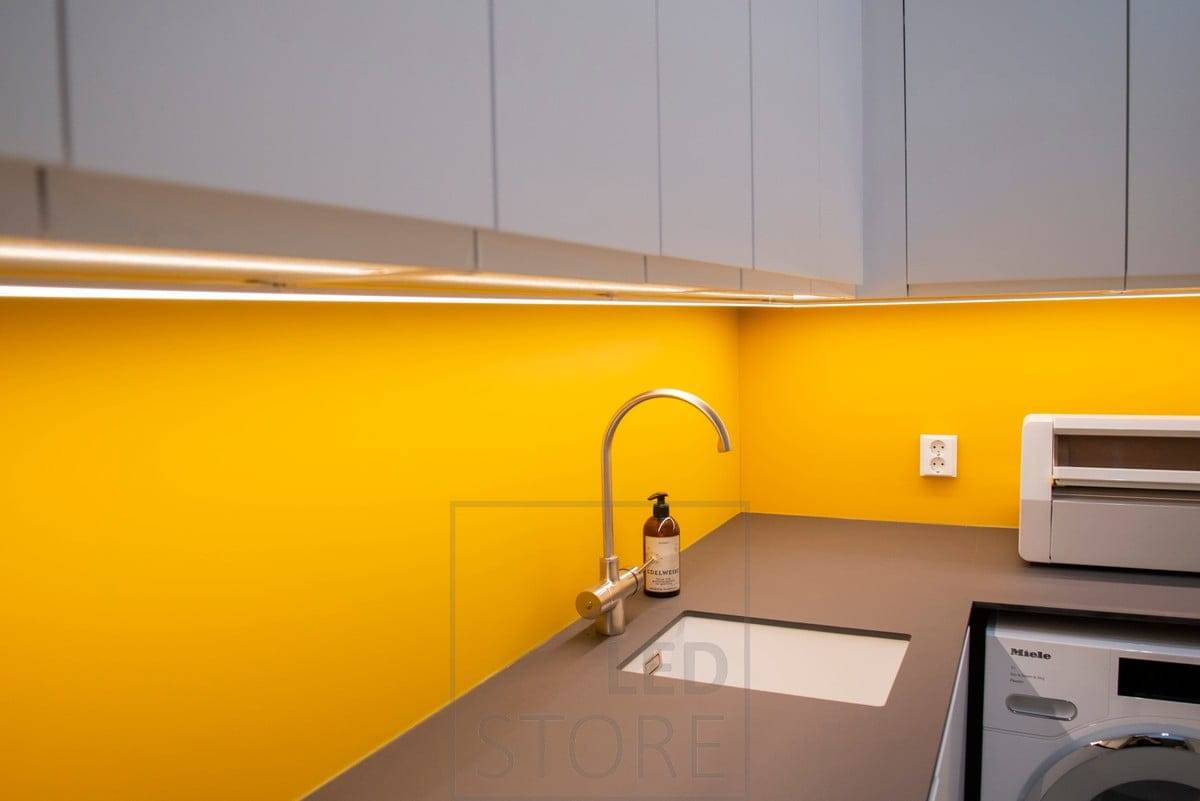 The LED has a long life cycle. The colourful space in the utility room is illuminated by an LED strip in a surface profile.  Ledstore.fi