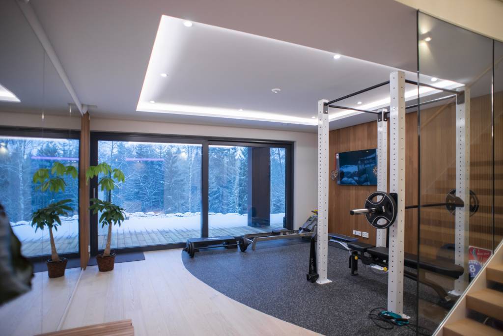 Indirect LED strip lighting along the edges in a lowered ceiling space.