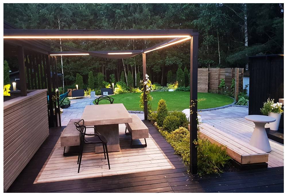 The top of the pergola lighted up with LED strips on three sides