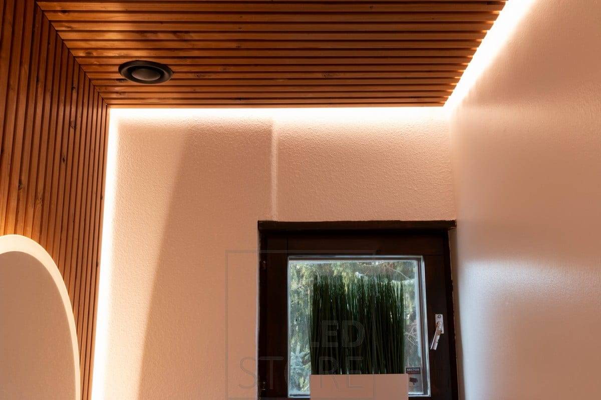 A LED strip behind the toilet ledge creates atmospheric indirect light. Ledstore.fi