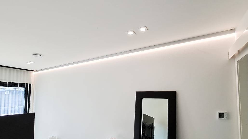 Indirect light installed in the bedroom ceiling and spotlights as general lighting.