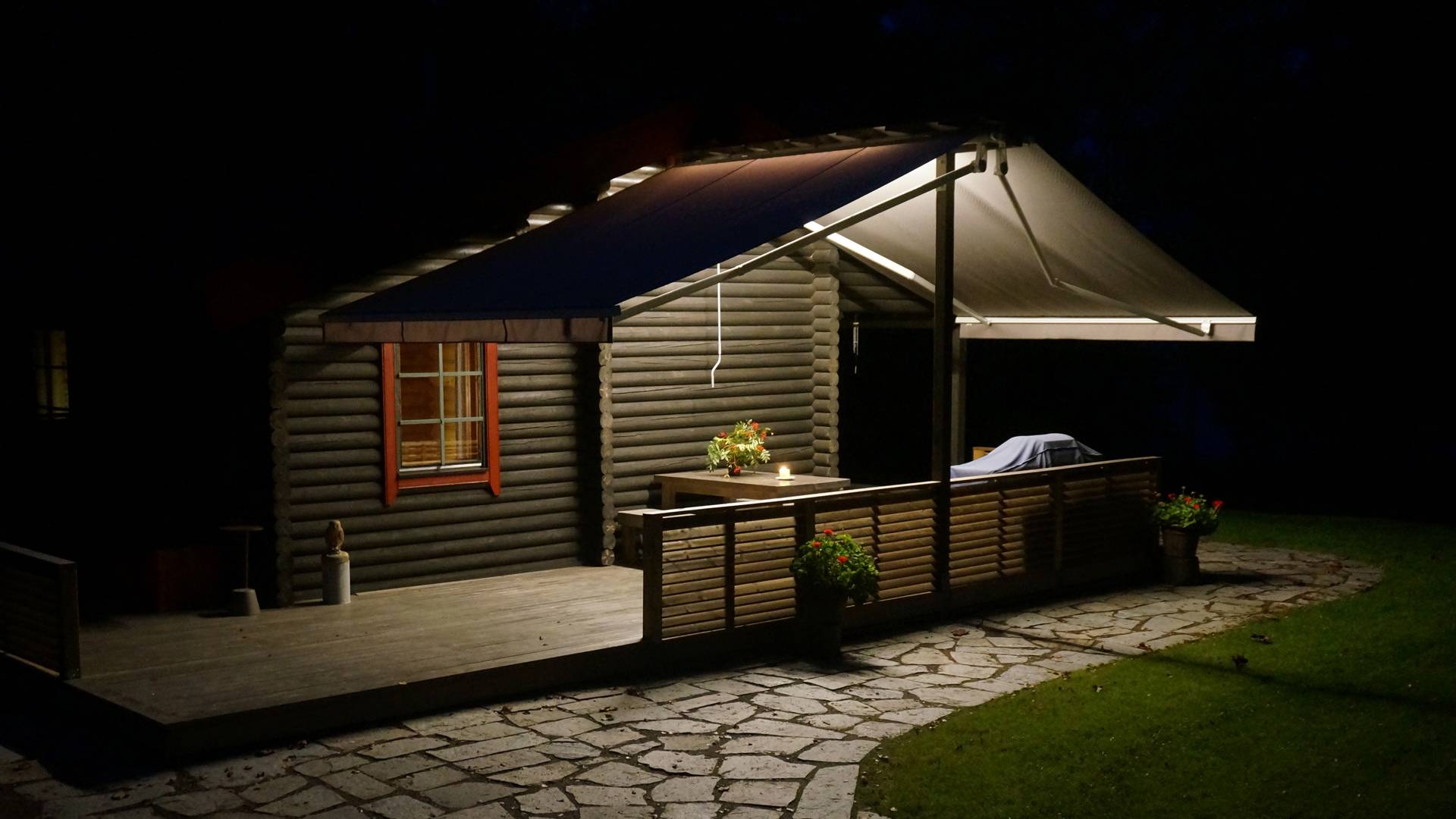 A terrace with canopy lit with LED strip looks cozy.  