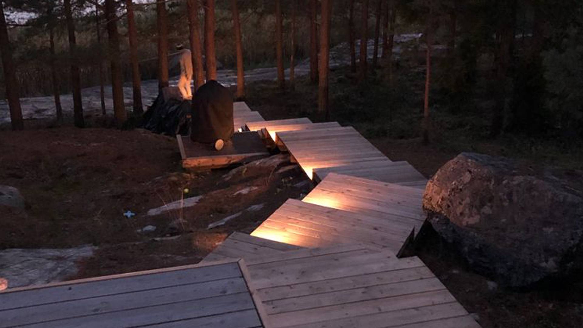 Terrace step lighting with spotlights mounted on the riser.