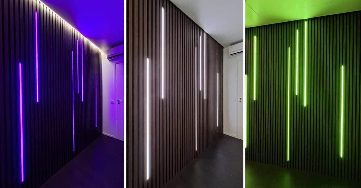 Slatted wall with purple, white and green led lights.