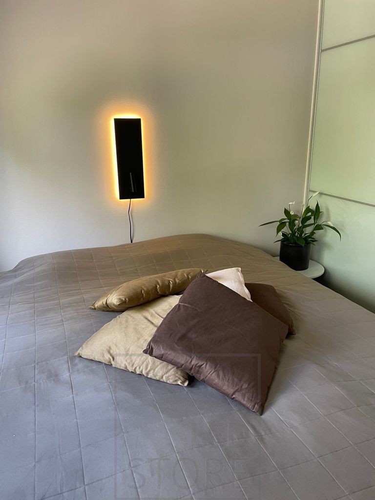 Black NIGHT reading and night light at the head of the bed. Illuminates with indirect mood light and directional reading light. Also available in white and with plug. Ledstore.fi