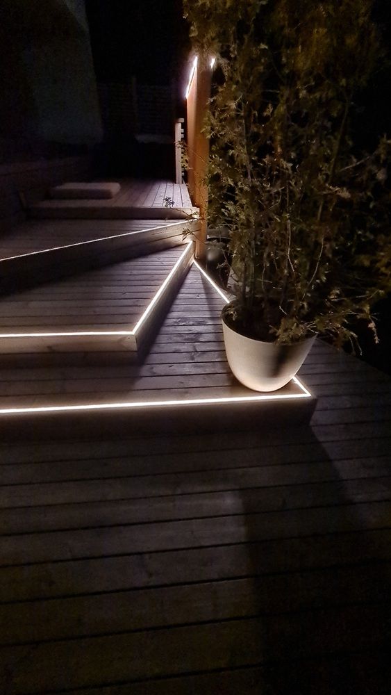 LED NEON strip flush-mounted on the edge of the external ceiling.