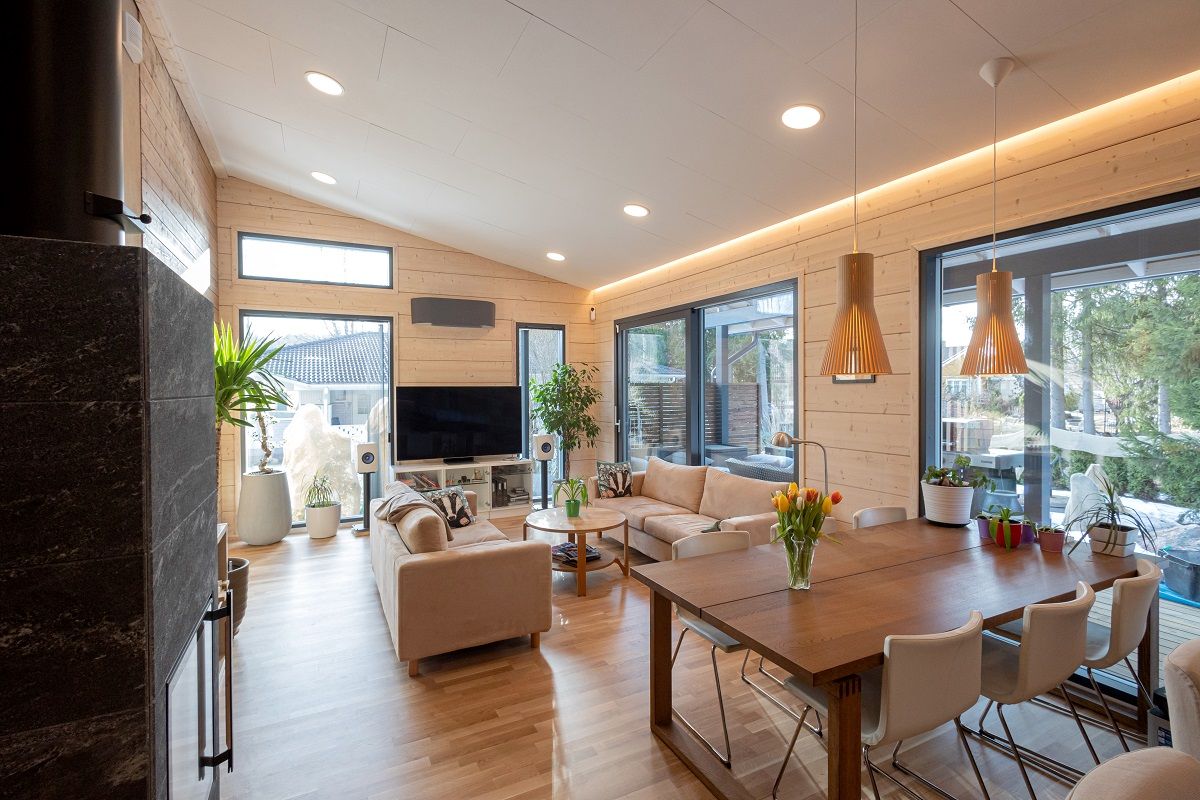 The living room-kitchen is lit with LED strip and panels.
