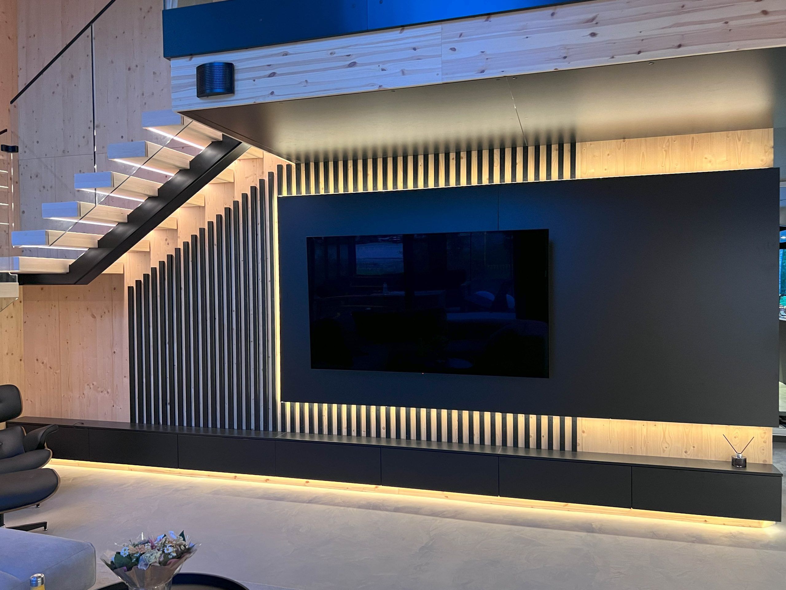 The TV corner has been illuminated to give the space additional mood lighting.